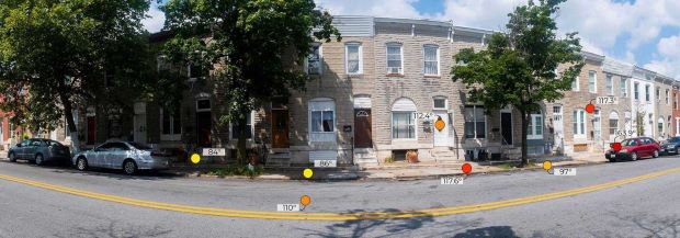 Photo of rowhouses showing that dark, non-porous surfaces in urban areas lead to extreme heat