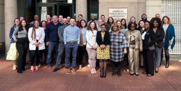 APHA staff standing in front of the APHA building in Washington, D.C.