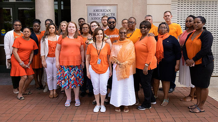 APHA staff in orange clothing