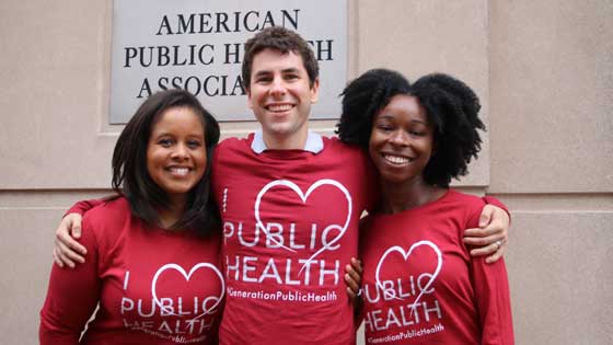 three APHA staffers in I love public health T shirts