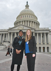 two women standing in front of capitol building