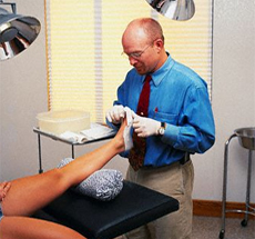 Doctor examining patients foot