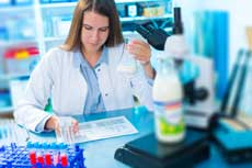 scientist analyzing milk bottle