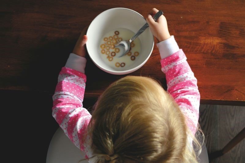 Girl with a bowl of cereal