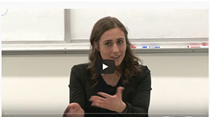 student gesturing at microphone