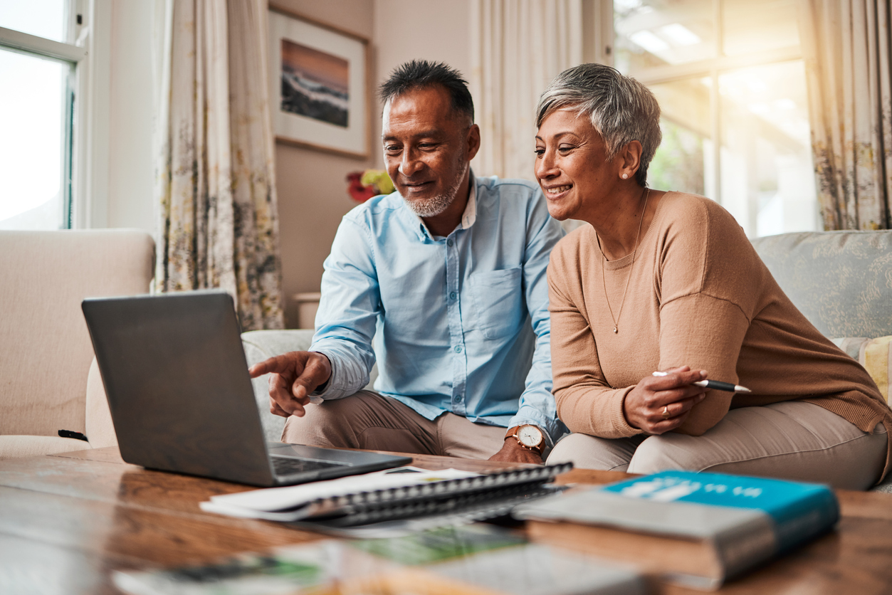 Older couple looking at a laptop together