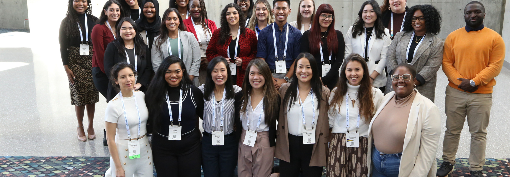 Group of about 20 leadership program participants posing and smiling.