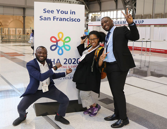 three people hamming it up in front of See You in San Francisco sign