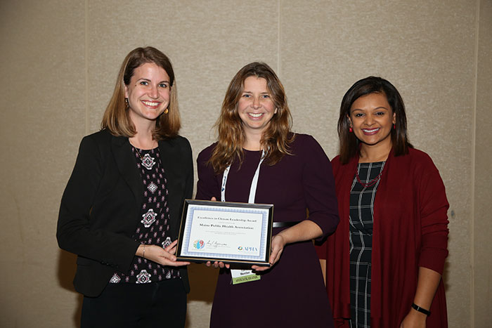 Rachel McMongale and Surili Patel with climate award winner 