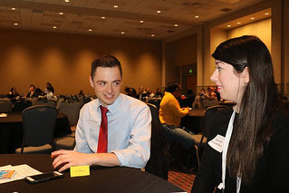 students talking at table