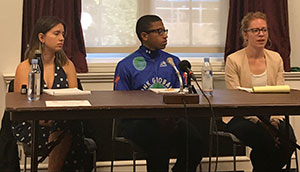 three teens at table, one speaking