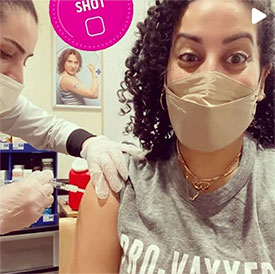 masked woman getting vaccinated