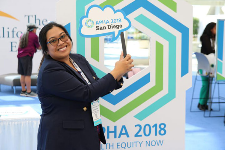 Smiling woman and APHA 2018 photo booth