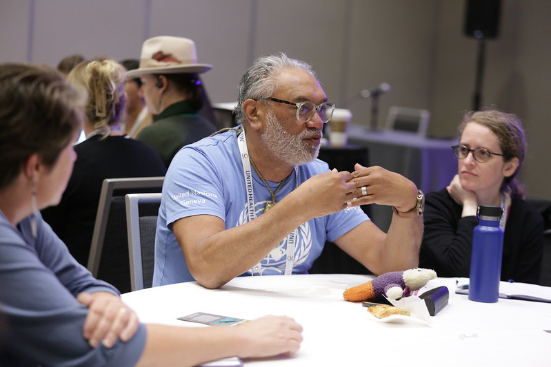 Man speaking at a table at APHA annual meeting