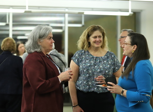 people having a conversation at a reception