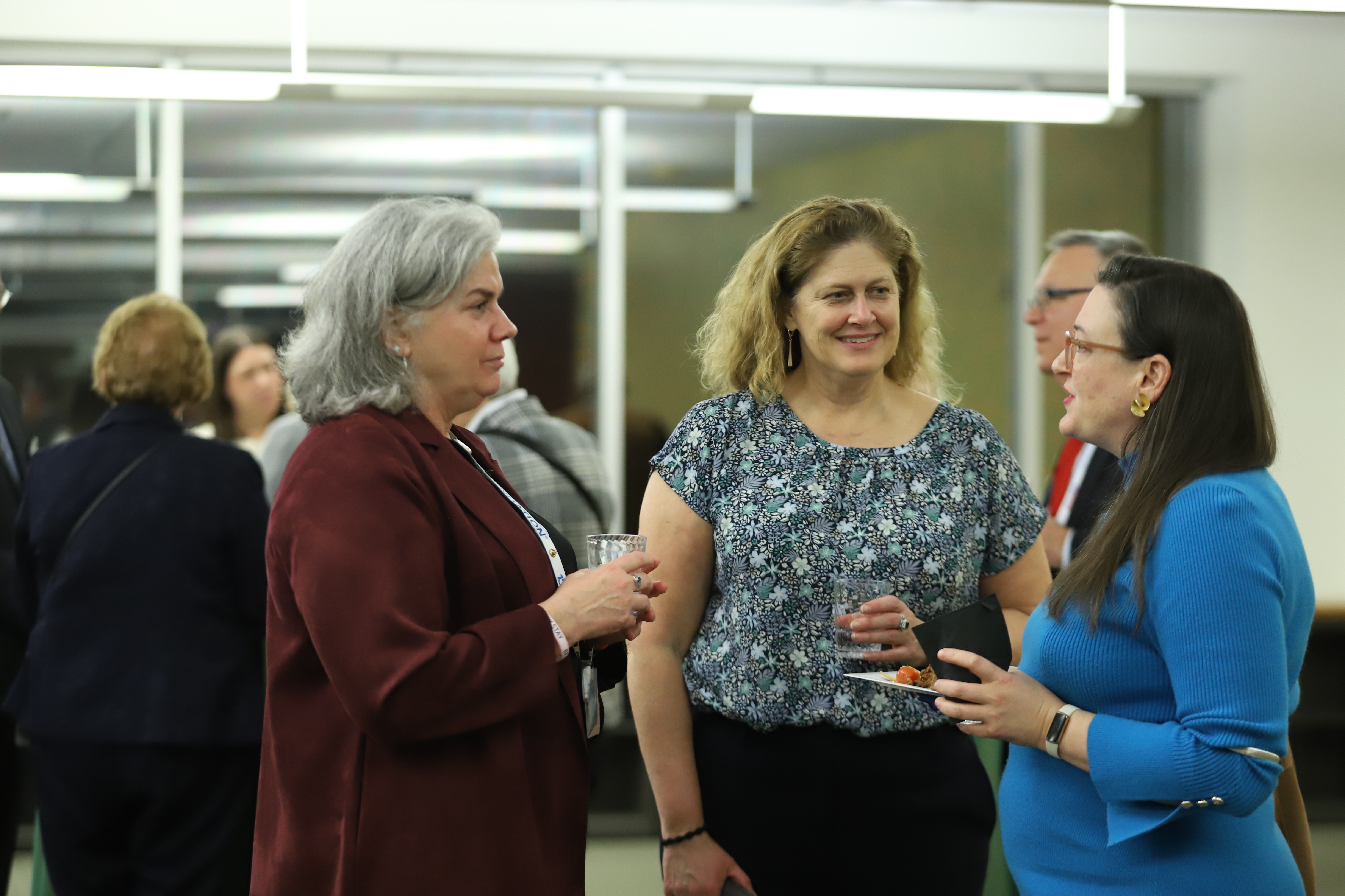 people having a conversation at a reception