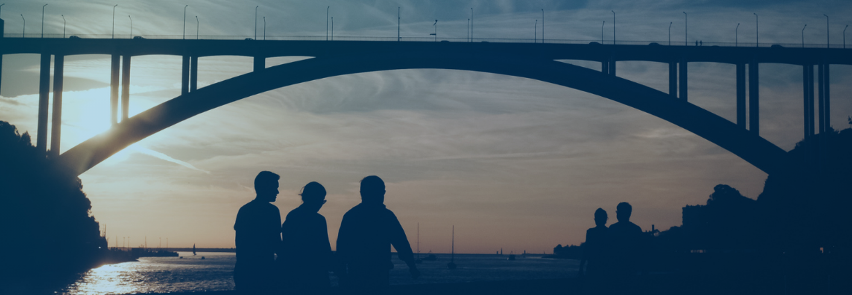 Bridge with people walking under it 