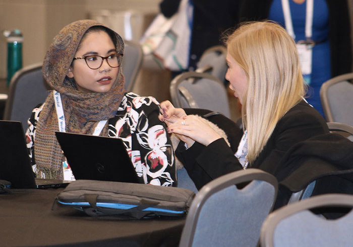 two women speaking