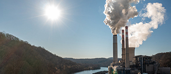 Smokestacks emit pollution from a coal-powered factory near Morgantown, West Virginia.