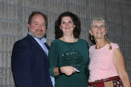 Tom Quade and two awardees smiling
