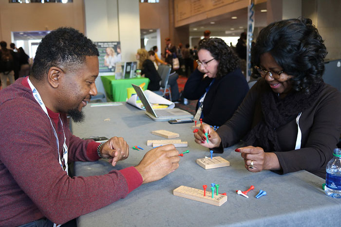 people playing board games