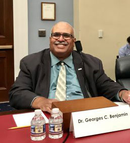 Smiling Dr. Benjamin at table