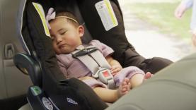 Baby asleep in a car seat