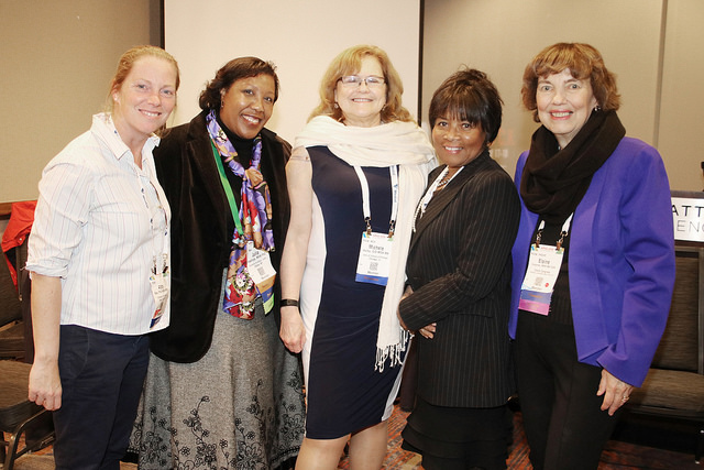 five smiling women