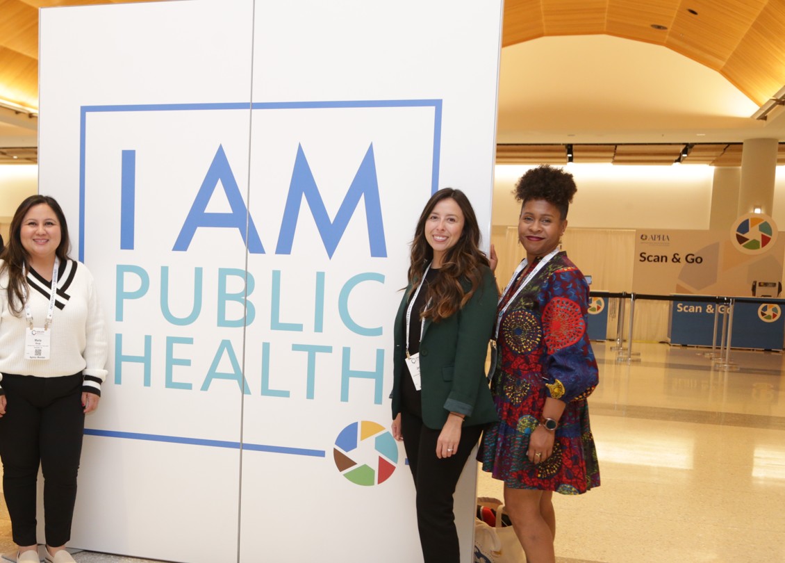 I am public health sign with 3 people