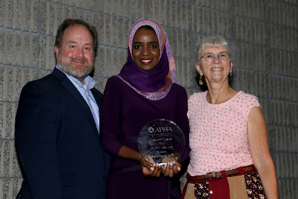 Tom Quade and two awardees smiling