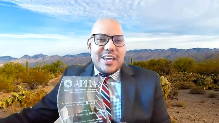 Omar Escontrías displaying Ayman El-Mohandes Young Professional Public Health Innovation Award