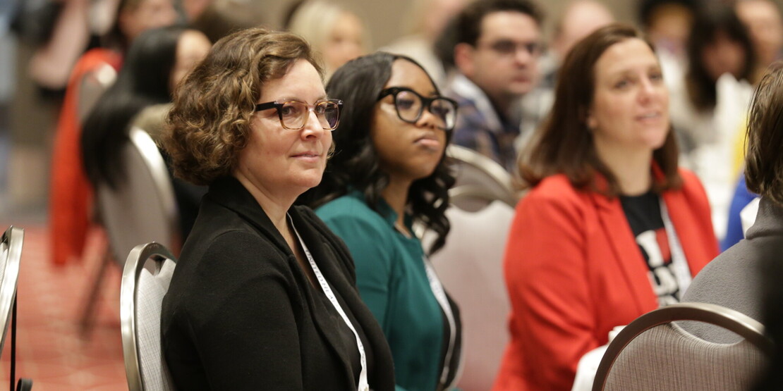 APHA 2024 conference photo of two people sitting at a table