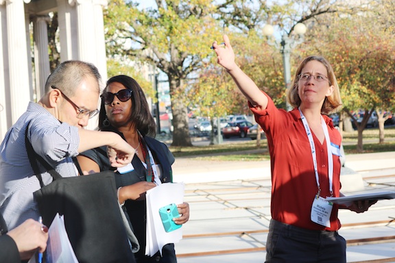 woman gesturing to her left