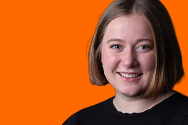 Emma Courtney in front of orange backdrop