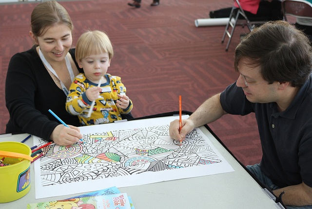 mom and dad coloring with toddler boy