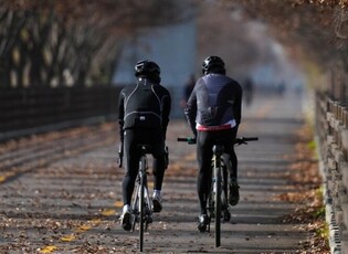 Two people biking during daytime