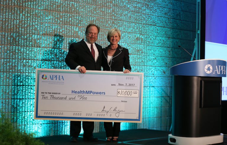 Tom Quade giving Beverly Townsend large check