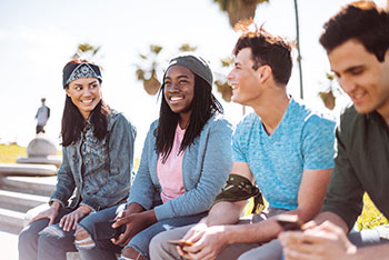 smiling teen boys and girls