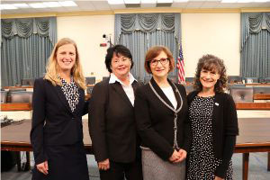 four smiling women