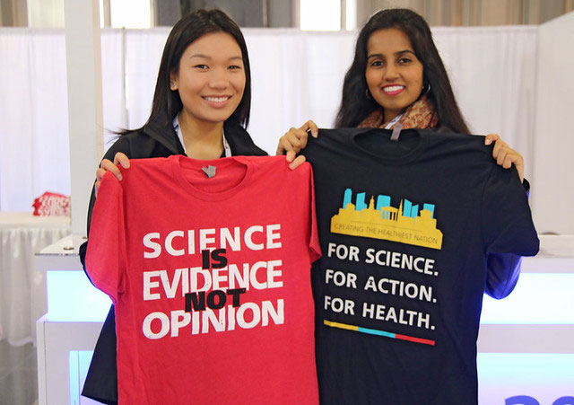 women displaying Annual Meeting T-shirts