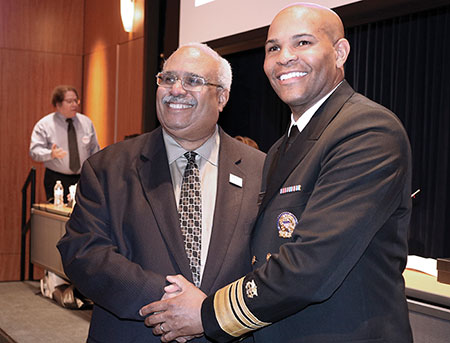 Georges Benjamin and Jerome Adams smiling