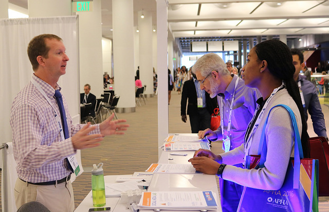 Patrick Benko talks with visitors to APHA Social Media Lab
