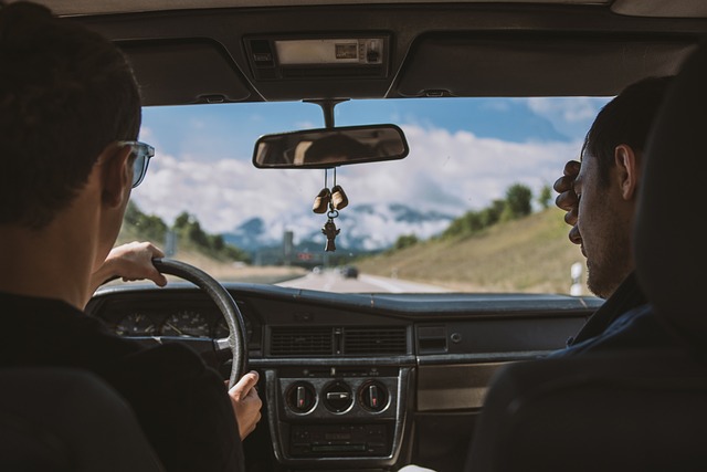 Two people driving in a car