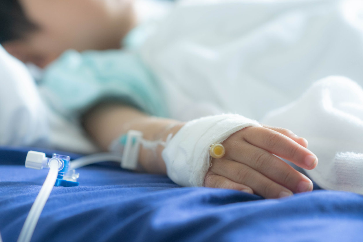 Person with an IV in hand