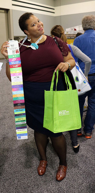 Rosa Riley showing off her many name badge ribbons