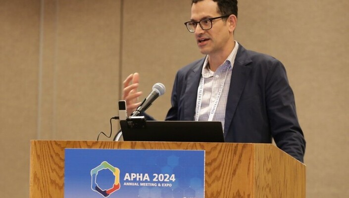 Man presenting at annual meeting